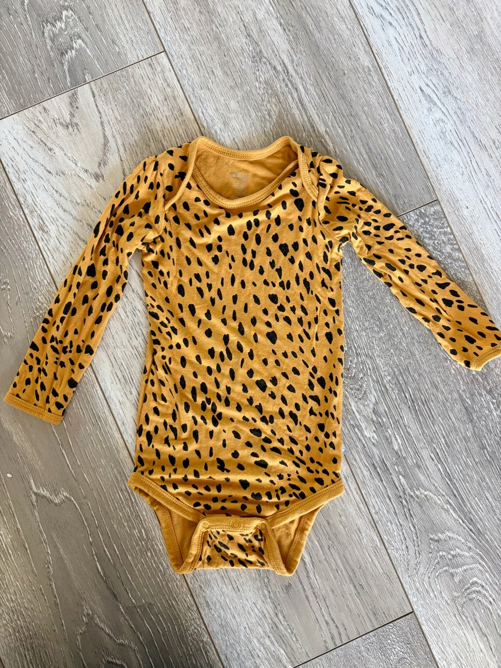 Kyte Baby Long Sleeve Bodysuit in Marigold Cheetah 12-18M